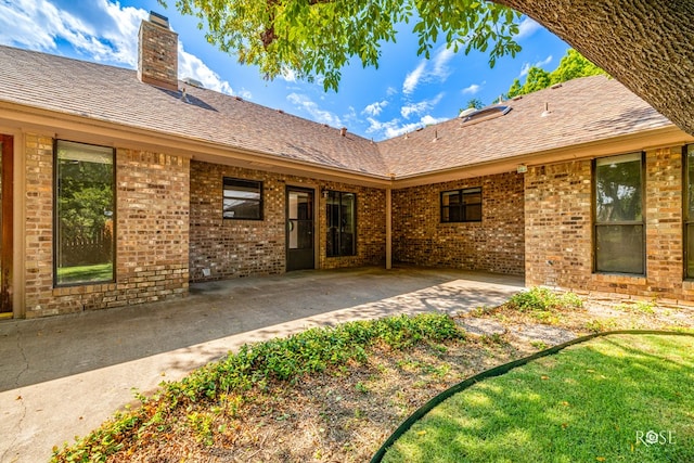 back of property featuring a patio area