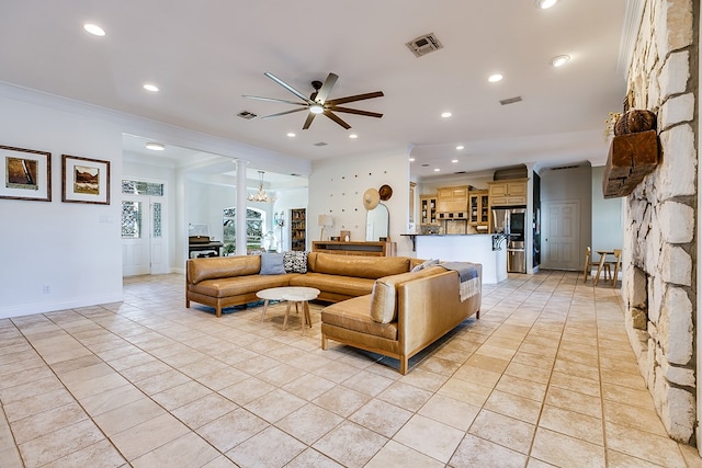 tiled living room with ornamental molding and ceiling fan with notable chandelier