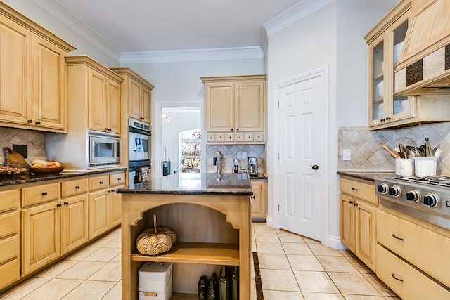 kitchen featuring tasteful backsplash, light tile patterned floors, light brown cabinets, and a kitchen island