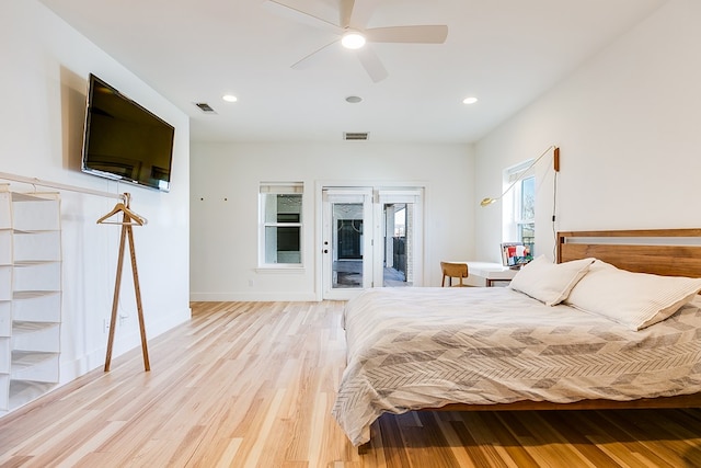 bedroom with ceiling fan, light hardwood / wood-style flooring, and access to outside