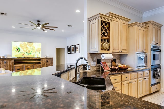 kitchen with sink, crown molding, light brown cabinets, stainless steel appliances, and decorative backsplash