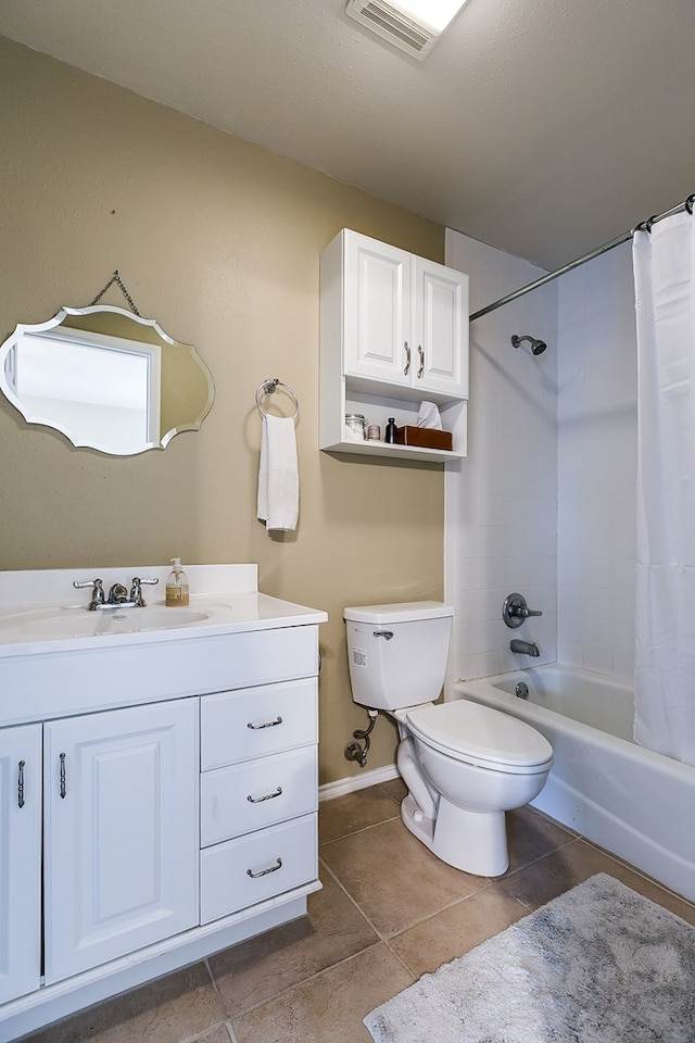 full bathroom featuring tile patterned flooring, vanity, toilet, and shower / bath combo with shower curtain