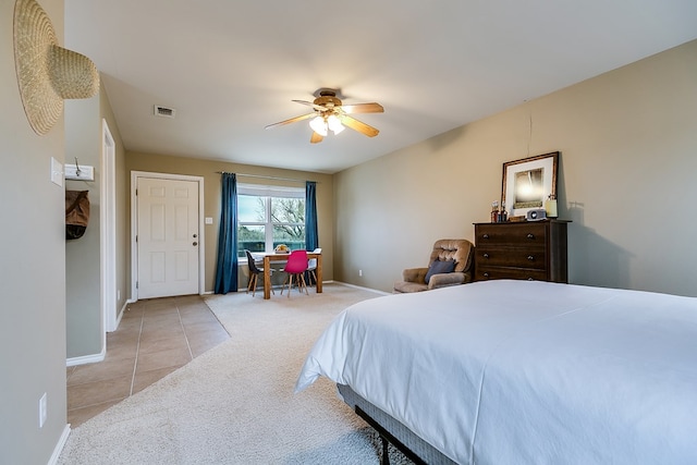 bedroom featuring ceiling fan and light carpet