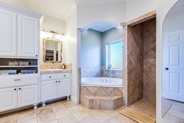 bathroom featuring tile patterned flooring, crown molding, separate shower and tub, and vanity