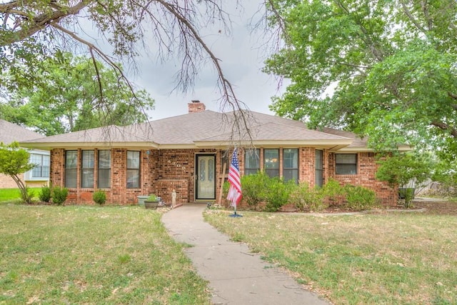 ranch-style home featuring a front yard