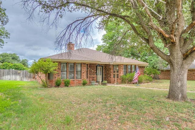 ranch-style house with a front lawn