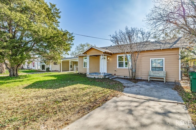 101 W 31st St, San Angelo, TX 76903 - view of front of property with a front yard, roof with shingles, and covered porch