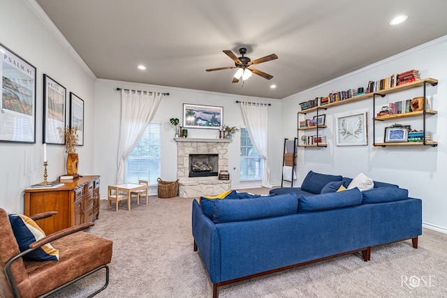 6027 Warwick Dr, San Angelo, TX 76901 - living room featuring light colored carpet, ornamental molding, ceiling fan, recessed lighting, and a stone fireplace