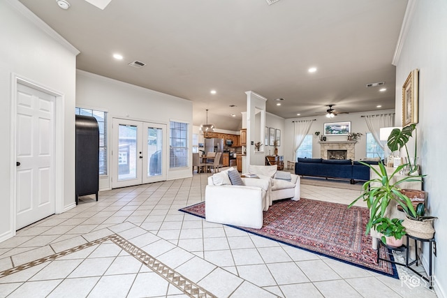 6027 Warwick Dr, San Angelo, TX 76901 - living area with crown molding, french doors, ceiling fan, recessed lighting, and a fireplace