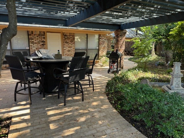 view of patio featuring a pergola and grilling area