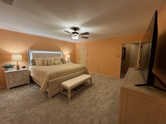 bedroom with light carpet and ceiling fan