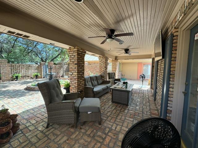 view of patio / terrace with ceiling fan and outdoor lounge area