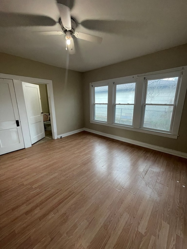 unfurnished bedroom featuring ceiling fan and light hardwood / wood-style floors