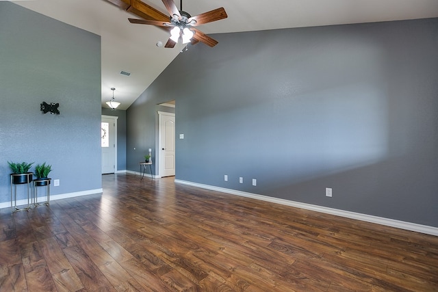 spare room with ceiling fan, high vaulted ceiling, and dark hardwood / wood-style flooring