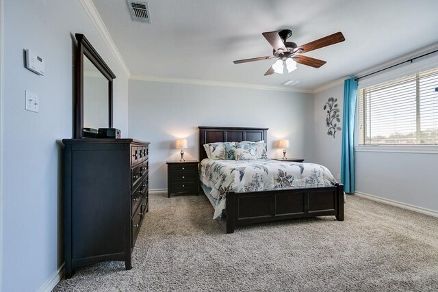 bedroom with crown molding, ceiling fan, and carpet flooring