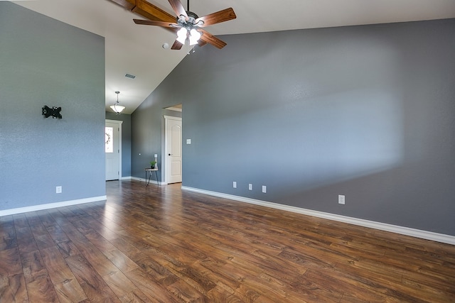 empty room featuring dark wood-type flooring, ceiling fan, and high vaulted ceiling