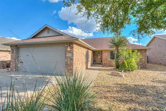 ranch-style home featuring a garage