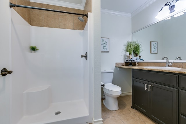 bathroom featuring vanity, tile patterned flooring, crown molding, and a shower