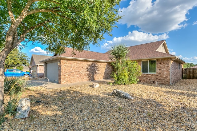 ranch-style house featuring a garage