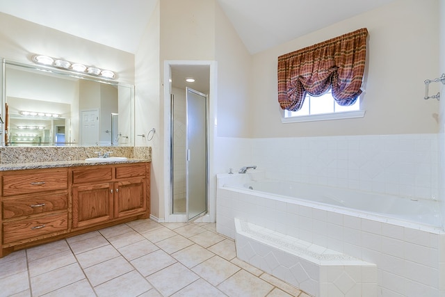 bathroom featuring lofted ceiling, vanity, tile patterned floors, and separate shower and tub