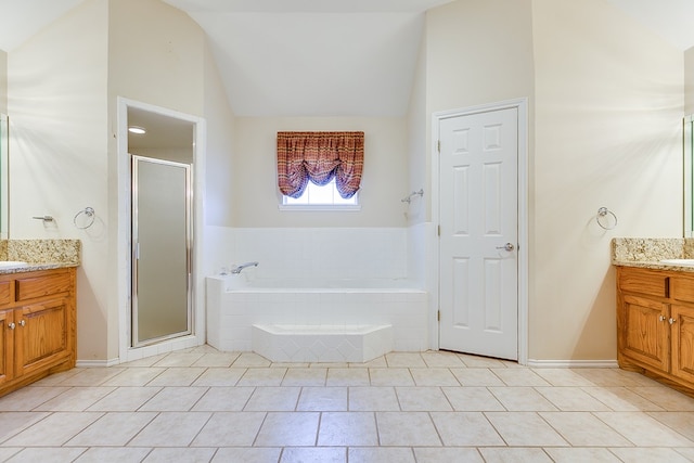 bathroom with lofted ceiling, vanity, tile patterned flooring, and separate shower and tub