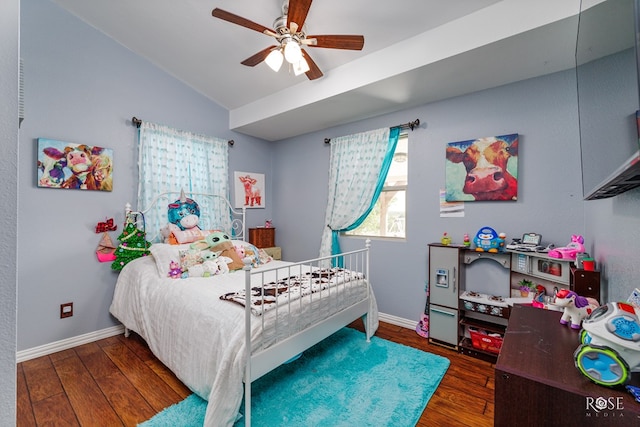 bedroom featuring dark hardwood / wood-style flooring, lofted ceiling, and ceiling fan