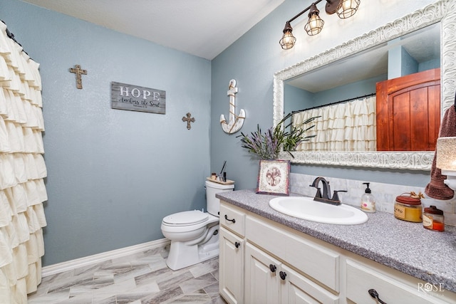 bathroom with vanity and toilet