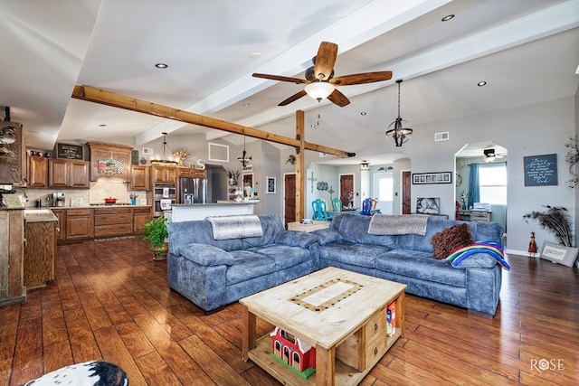 living room with lofted ceiling with beams, dark hardwood / wood-style floors, and ceiling fan