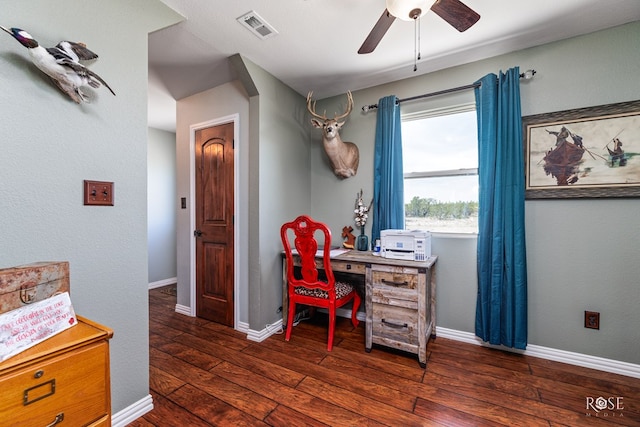 home office with ceiling fan and dark hardwood / wood-style flooring