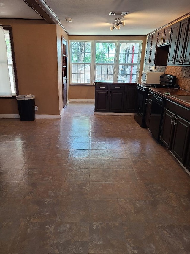 1811 Willow St, San Angelo, TX 76901 - kitchen featuring black appliances, decorative backsplash, baseboards, and dark countertops