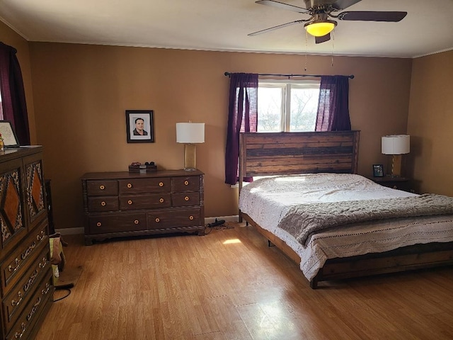 1811 Willow St, San Angelo, TX 76901 - bedroom with light wood-type flooring, ceiling fan, baseboards, and ornamental molding