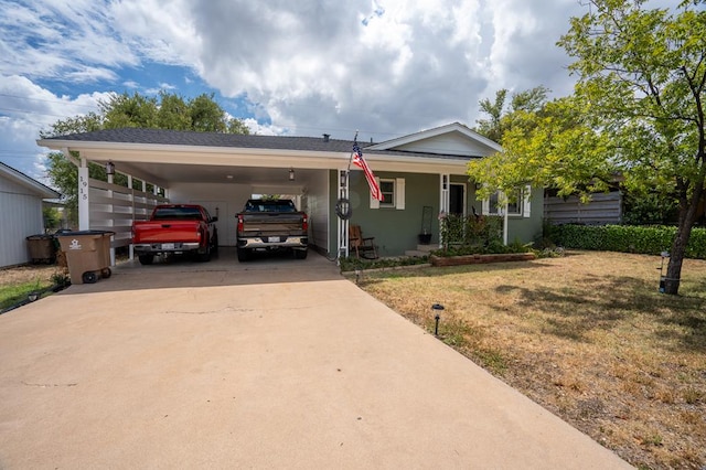 view of front of property featuring a carport and a front lawn