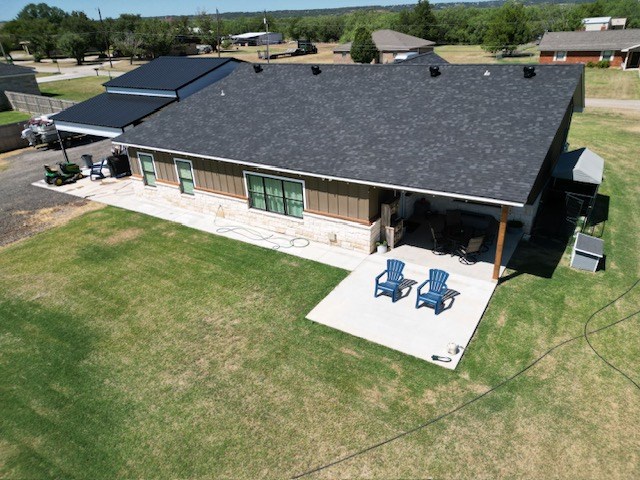 110 Vick Dr, Brownwood, TX 76801 - back of house with a lawn and a patio area