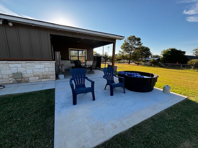 110 Vick Dr, Brownwood, TX 76801 - view of patio with an outdoor fire pit