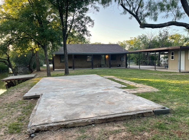 1619 Canal Rd, San Angelo, TX 76904 - rear view of house with a lawn