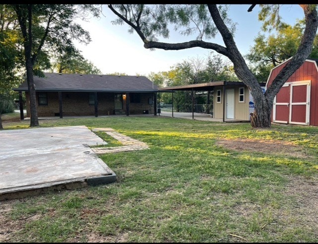 1619 Canal Rd, San Angelo, TX 76904 - view of grassy yard with a storage unit