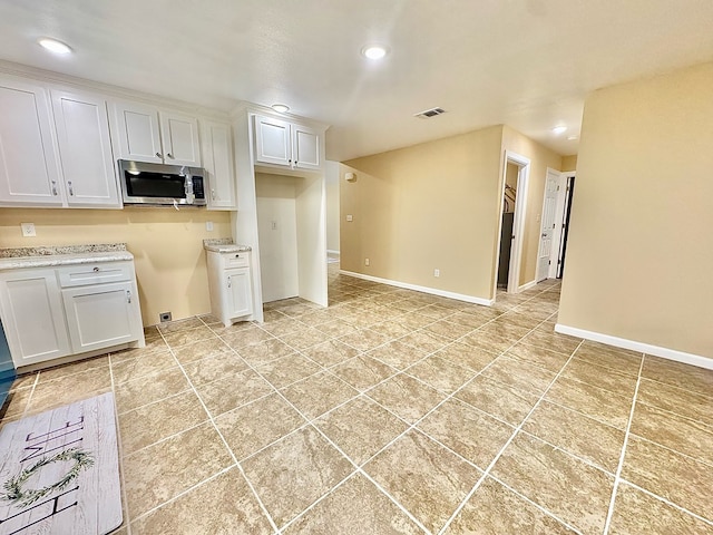 kitchen featuring white cabinets