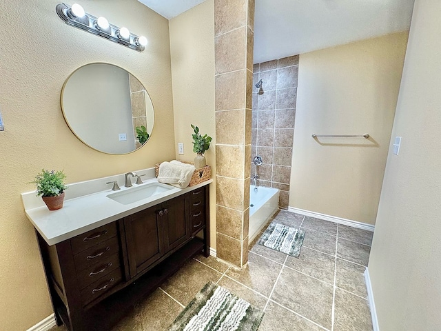 bathroom with vanity and tiled shower / bath combo