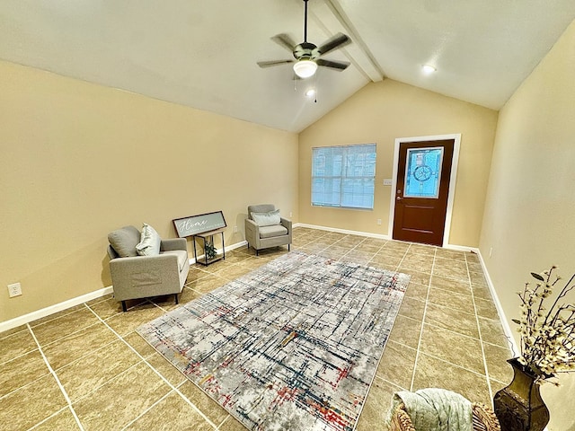 sitting room with vaulted ceiling with beams, tile patterned floors, and ceiling fan