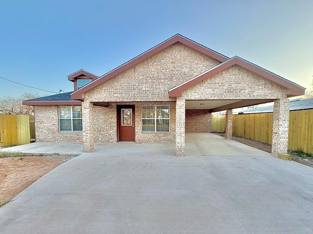 ranch-style home with a carport