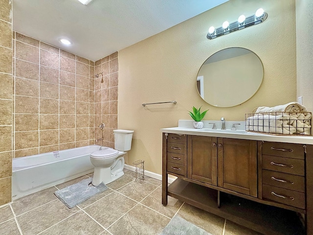 full bathroom with tiled shower / bath, vanity, toilet, and tile patterned flooring