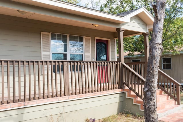 property entrance featuring covered porch