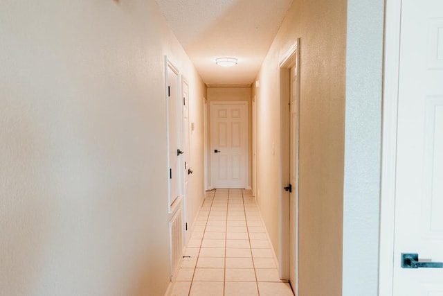 hallway with light tile patterned floors