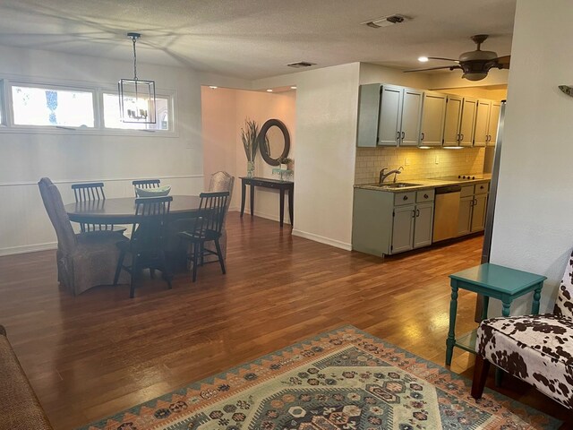 dining space featuring ceiling fan, wood-type flooring, and sink