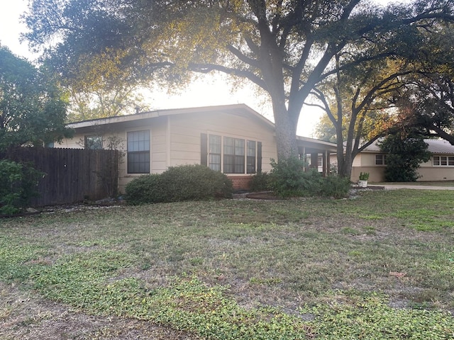 view of home's exterior with a lawn