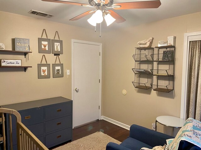 bedroom featuring dark hardwood / wood-style floors and ceiling fan