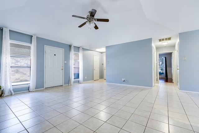 unfurnished living room with light tile patterned floors, visible vents, baseboards, and ceiling fan