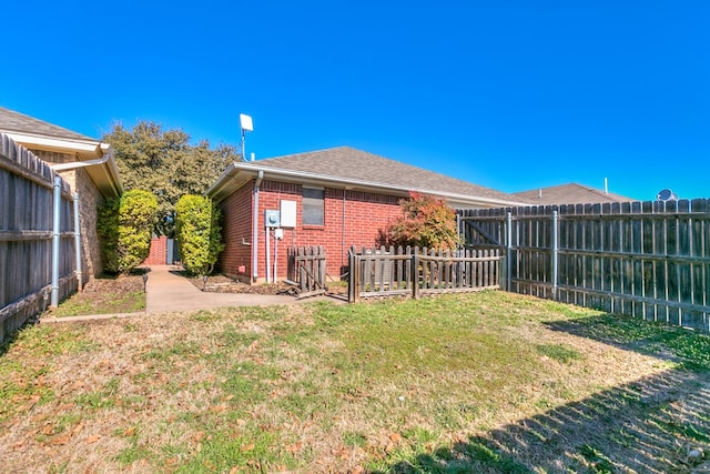 view of yard with a fenced backyard