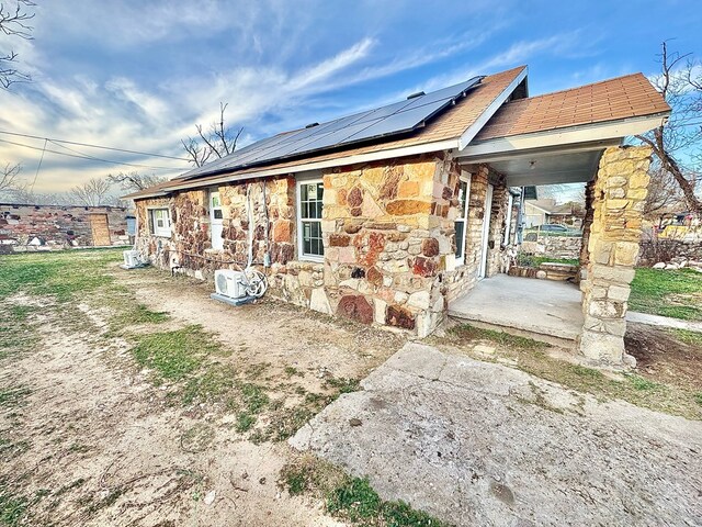 exterior space featuring solar panels