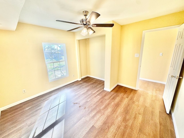 unfurnished room featuring ceiling fan and light hardwood / wood-style floors